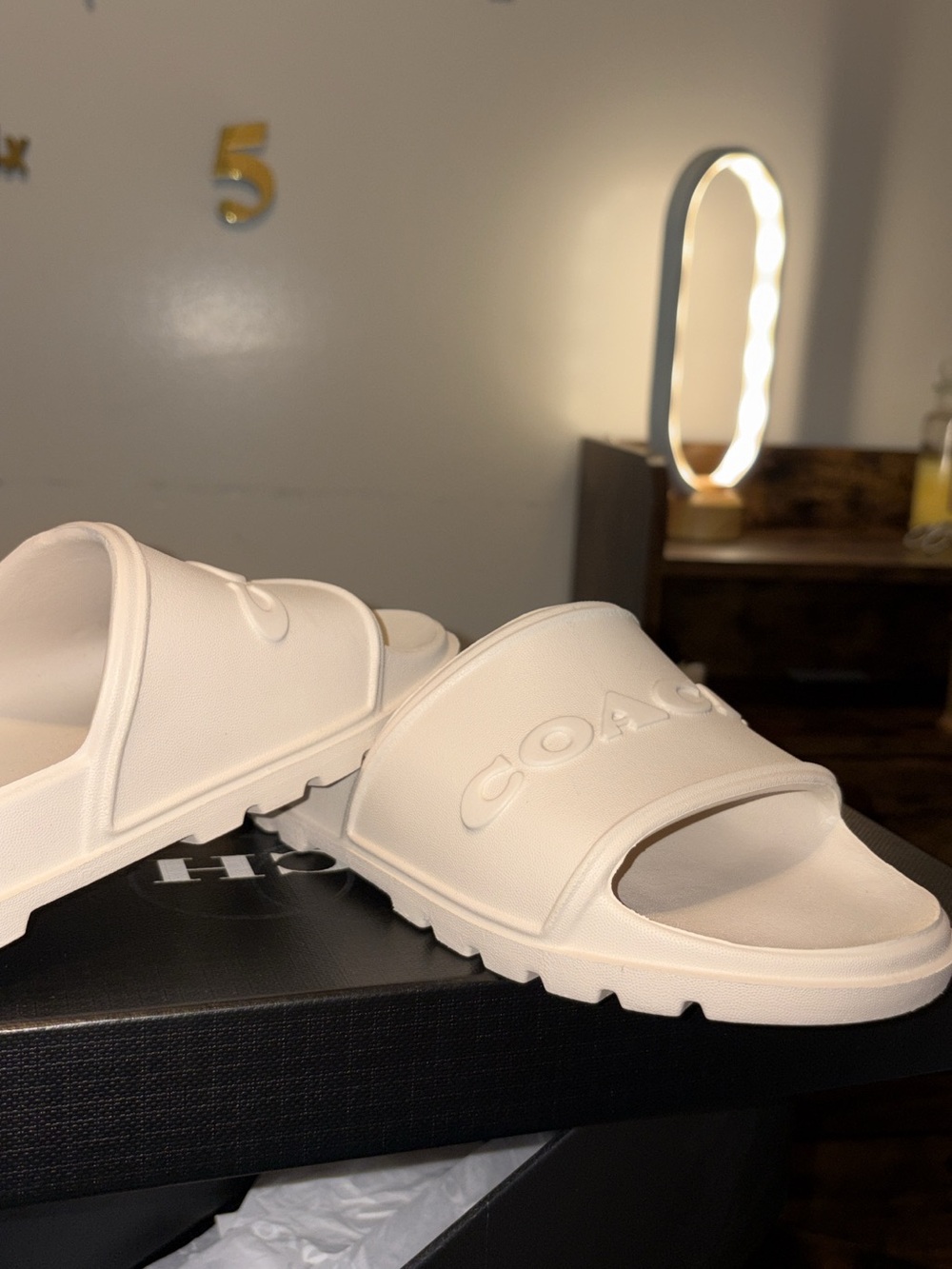 Coach Women’s Cream Slide Sandals with Embossed Logo